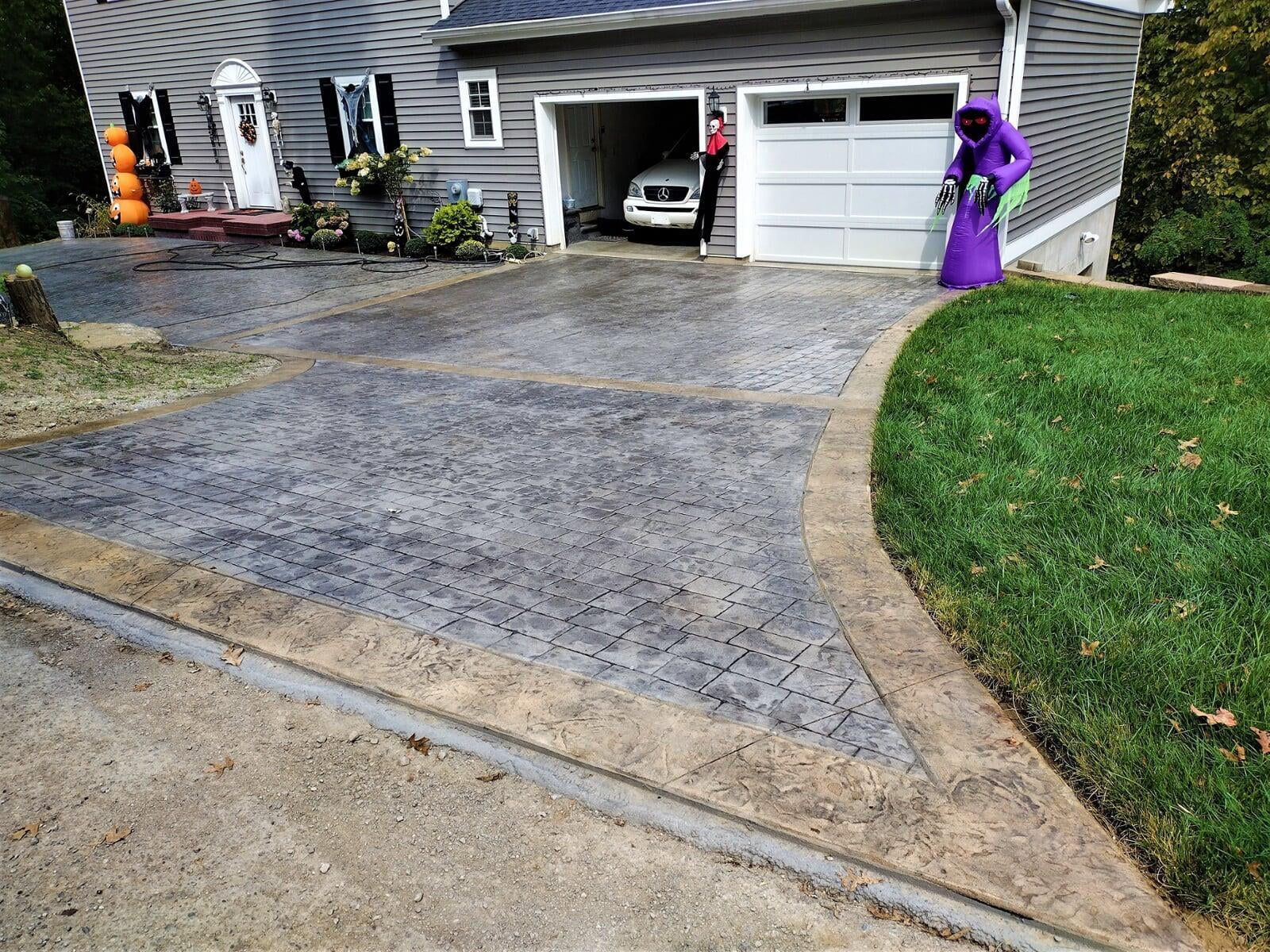 Stamped Concrete Cobblestone with Stone Borders and Ribbons