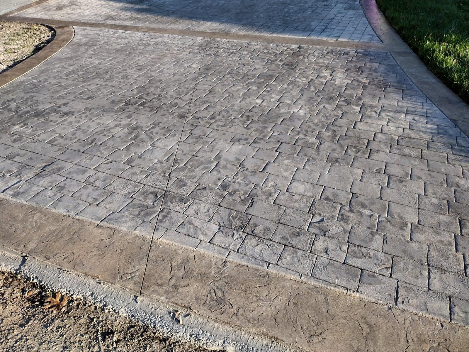 Stamped Concrete Cobblestone Driveway with Stone Borders